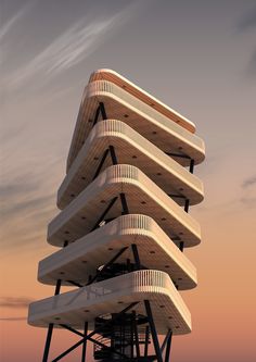 a tall building with many balconies on it's sides in the sunset