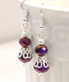 Purple Crystal Earrings, Metallic Purple & Silver Dangles, Wedding Jewelry, Royal Purple Jewelry, Holiday Gift, Bridesmaid Earrings 8mm and 10mm metallic purple crystal earrings, accented with diamond dust silver beads. Silver plated french hook ear wires. 1.5" earrings. #E739 Wanna See More? Click below for other items available: http://www.etsy.com/shop/StudioMJewelry Shipping: All jewelry pieces are ready to ship. Items are shipped to your Etsy address, via USPS First Class mail with tracking Jewelry Royal, Jewelry Holiday, Prom Earrings, Purple Jewelry, Purple Crystal, Royal Purple, Purple Crystals, Bridesmaid Earrings, Silver Beads