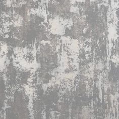 an old, grungy wall with white and gray paint