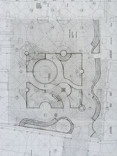 an architectural drawing shows the plan for a garden area with circular seating areas, and several circles