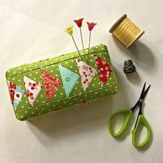 sewing supplies including scissors, thread and spools