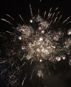 fireworks are lit up in the night sky