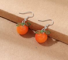 Bright and cute little orange tangerine drop earrings in orange and green. Orange Earrings For Summer Gifting, Handmade Apricot Earrings Perfect For Gifts, Handmade Apricot Earrings For Gift, Handmade Orange Earrings For Summer, Summer Orange Drop Earrings, Trendy Orange Earrings For Summer, Orange Dangle Resin Earrings, Orange Resin Dangle Earrings, Cute Nickel-free Orange Jewelry