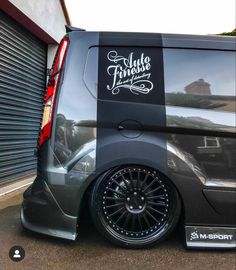 a van parked in front of a garage door