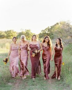 the bridesmaids are all wearing different dresses