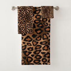 leopard print towels hanging on a towel rack