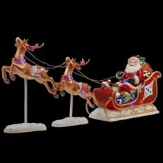 santa riding in his sleigh with reindeers and lights on it's back