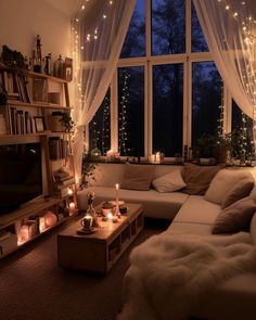 a living room filled with lots of furniture next to a window covered in fairy lights