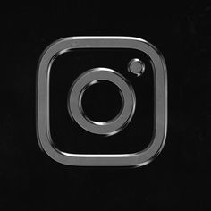 an instagram logo is shown in black and white with a silver circle on the bottom