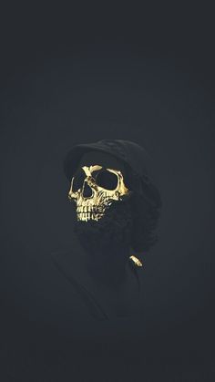 a man with a gold skull on his face wearing a black hoodie and hat