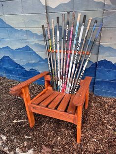 a chair made out of skis sitting in front of a wall