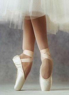 the legs and feet of a ballerina in ballet shoes, with text reading arclass