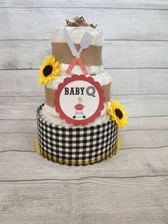 a baby shower cake with sunflowers on top