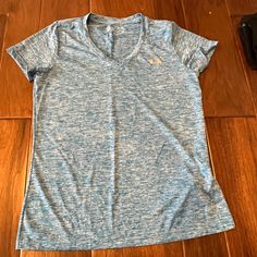 Under Armor Blue Workout Shirt Size Medium New Without Tags All Items Come From A Pet And Smoke Free Home Blue V-neck Athleisure Top, Blue T-shirt For Gym, Light Blue Short Sleeve Tops For Workout, Under Armour Short Sleeve Workout Top, Short Sleeve Under Armour Workout Top, Blue Short Sleeve Gym Tops, Under Armour Short Sleeve Casual Activewear, Under Armour Casual Activewear Short Sleeve, Under Armour Sporty Shirt For Sports