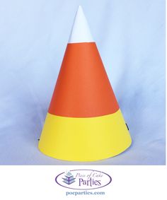 an orange, white and yellow traffic cone on a blue background