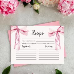 a recipe card with pink flowers and greenery on the side, next to it