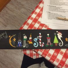 there is a christmas themed sign on the table