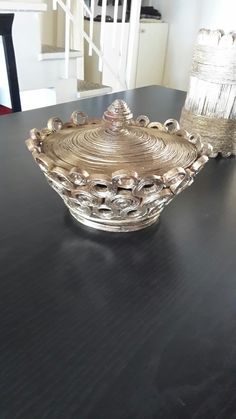 a glass bowl sitting on top of a wooden table