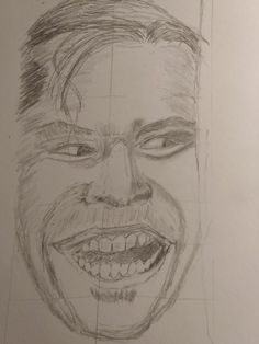 a pencil drawing of a smiling man's face