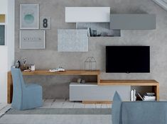 a living room filled with furniture and a flat screen tv on top of a wooden shelf