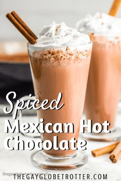 two glasses filled with mexican hot chocolate and cinnamon sticks