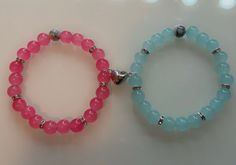 Pink and blue matching bracelets Blue Bracelets With Heart Charm And Round Beads, Casual Blue Heart-shaped Bracelets, Casual Blue Heart-shaped Bracelet, Casual Heart Charm Bracelet With Round Beads, Bracelets Black, Blue Beaded Bracelets, Beads Bracelets, Couple Bracelets