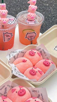 three plastic trays filled with pigs and drinks