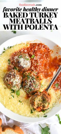 a white bowl filled with spaghetti and meatballs