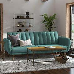 a living room with a blue couch and coffee table