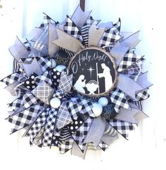 a black and white wreath with the words happy new baby on it