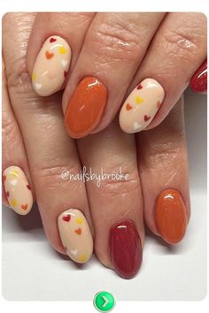 A warm, heart-themed fall nail design with pops of orange and red, blending fun and elegance for November nails that are perfect for casual or special occasions. Scarecrow Nail Ideas, Autumnal Nails, Donut Candles, Turkey Nails, Thanksgiving Nail Art, Thanksgiving Nail, Fall Manicure