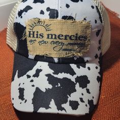 Reborn Creations- Christian Cow Print Hat With Distressed Patch. The Hat Has Criss-Cross Design For A Ponytail. Cow Print Hat, Hat Bar, Christian Hats, Floral Camo, Black Bucket Hat, Pom Pom Beanie Hat, Pink Cap, Pink Beanies, Ponytail Hat