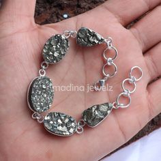 DESCRIPTION Stone  : Natural Pyrite Druzy Stone Shape : Mix Shape  Length : 7 to 10 Inch (Approx.) Materials: 925 Silver Plated/Gemstone Style : Bracelet Country/Region of Manufacture : India Made In : Jaipur Rajasthan  https://www.etsy.com/in-en/shop/MadinaJewelz?ref=seller-platform-mcnav The pictures shown are of the actual product that you will receive. Please note stone colors may look slightly different depending on your monitor calibration. All stones are natural, so little imperfections c Pyrite Stone, Pyrite Bracelet, Druzy Bracelet, Wedding Jewelry Bracelets, Bracelet Sterling Silver, Jaipur Rajasthan, Sterling Silver Bracelet, Wedding Bracelet, Bracelet Jewelry