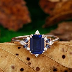 Engagement Ring Metal Type: 925 Sterling Silver, Soild 10k Gold, Solid 14k Gold, Solid 18k Gold Center Stone: Lab Created Sapphire Center Carat Weight: Emerald Cut 2CT (6x8mm) Side Stone: S Moissanite / Lab Created Alexandrite Side Carat Weight: 0.33ctw Band Width: 2mm SKU: ESAMXR0008-sapphire Accessories: *Shipped with beautiful ring box; *Directly price from Manufacturer, 1/3 the price from Jewelry Store; - Ethically Sourced Luxury Gold Radiant Cut Sapphire Ring, Luxury Timeless Tanzanite Sapphire Ring, Luxury Lab-created Sapphire Emerald-cut Diamond Ring, Emerald Cut Engagement Ring Sapphire, Square Sapphire Engagement Ring, Sapphire Emerald Cut Engagement Ring, Blue Sapphire Rings Engagement, Sapphire Accessories, Sapphire Wedding Ring Vintage