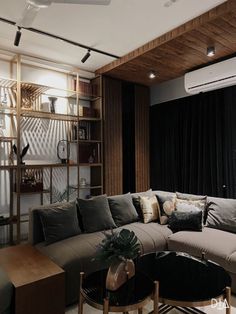 a living room filled with lots of furniture next to a wall mounted air conditioner