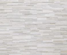 a white wood paneled wall textured with grey tones