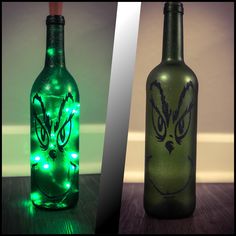 two bottles that have lights in them and one has a face drawn on the bottle