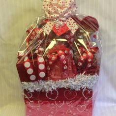 a red gift bag filled with chocolates and candy