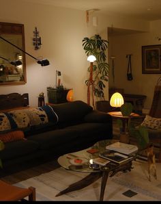 a living room filled with furniture and a lamp