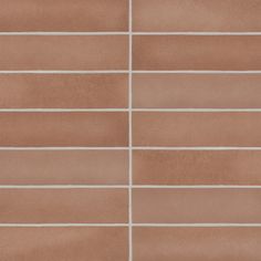 a brown tile wall with white lines on the bottom and one line in the middle