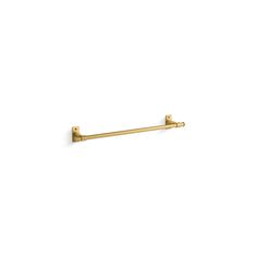 a gold toilet roll holder on a white wall with the handle extended to it's left side