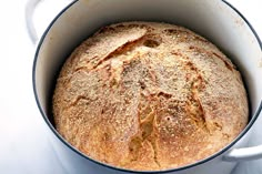 a loaf of bread in a white pot