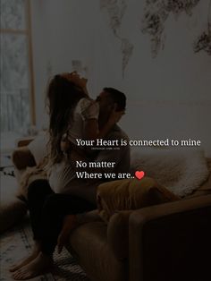 two people sitting on a couch with the caption your heart is connected to mine no matter where we are