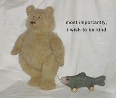 a teddy bear is next to a toy fish on a white background with the words most importantly, i wish to be kind