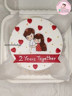 two years together cake in a white box