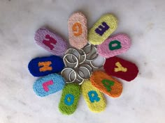 a bunch of crocheted flip flops sitting on top of a white table