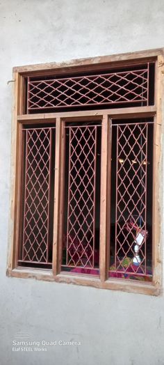 an old window with decorative iron work on it