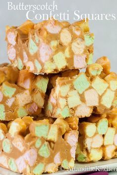 several pieces of cake sitting on top of a white plate covered in frosted candy