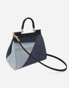 Medium Sicily bag in calfskin and patchwork denim: Blue Front flap with hidden double magnetic fastening Logo tag featuring two metal plating finishes Top handle and adjustable, detachable strap in calfskin Printed fabric lining Inner pocket Item comes with a branded dust bag Measurements: H18.5 x W20 x D10 cm Made in Italy Sicily Bag, Patchwork Denim, Denim Patchwork, Printed Fabric, Sicily, Denim Blue, Denim Fashion, Top Handle, Calf Skin