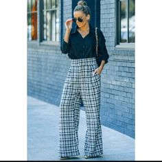 *Pattern Type: Plaid: Black, Camel, Brown, White, And Blue *Style: Casual, Business Casual, Work, Office, Career Trousers *Features *Length *Materials *Body *Imported *Product Measurements S Hip 42 In, Inseam 28 In, Waist 27 In, Outseam 42 In. Chic Plaid Wide Leg Pants, Elegant Plaid Pants For Spring, Chic Plaid Bottoms For Business Casual, Casual Plaid Wide Leg Pants, Trendy Plaid Bottoms For Day Out, Chic High-waisted Plaid Pants, Plaid High Waist Wide Leg Pants, Casual Plaid Pants For Work, Plaid High Waist Bottoms For Day Out